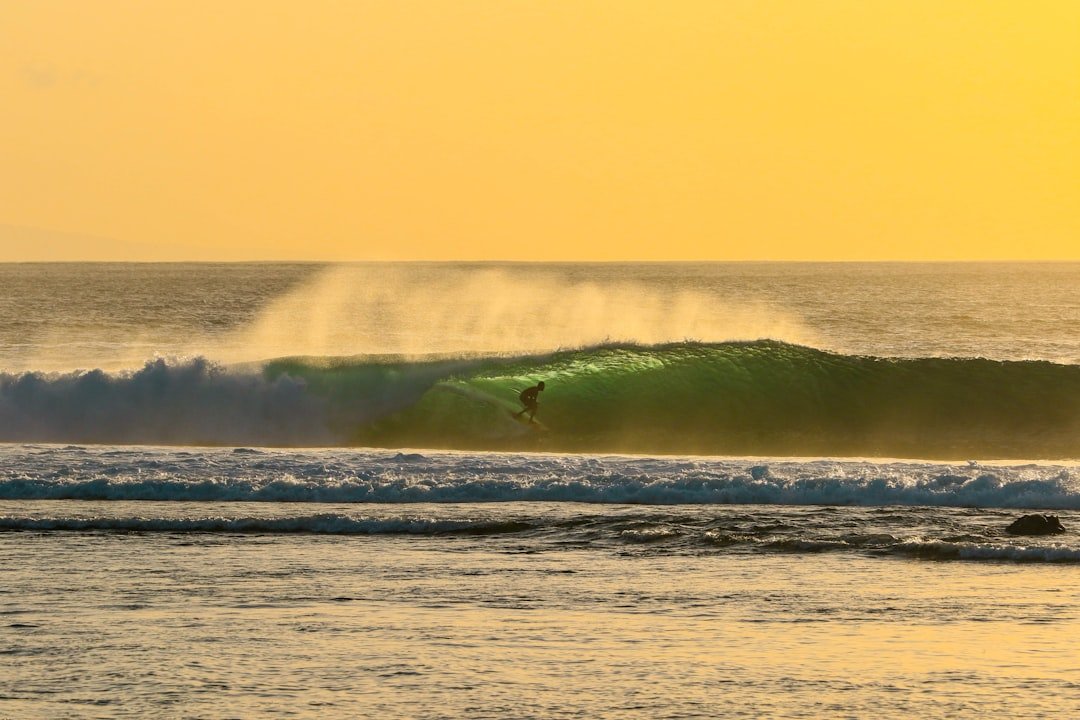 Tropical sunset over Gulf Coast beach waves