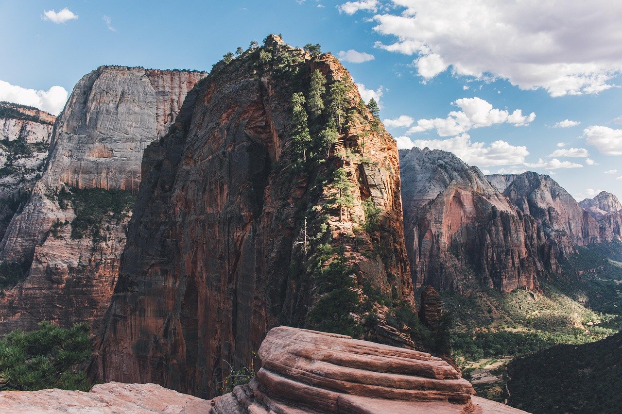Hiker at sunrise on Zion mountain trail