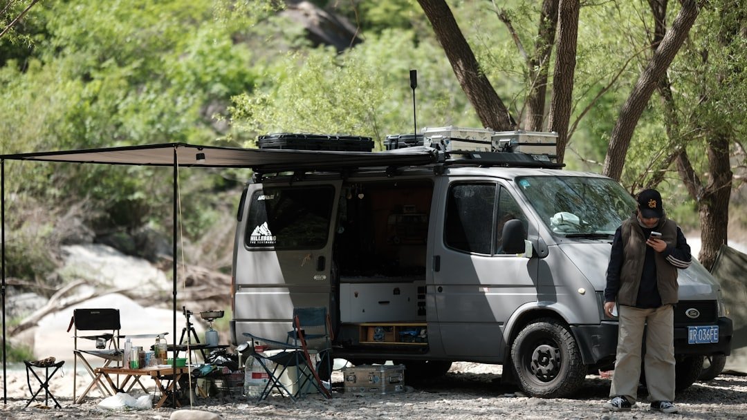 Remote campsite with van parked in nature showing freedom of off-grid travel