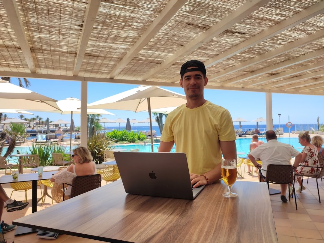 Digital nomad working from beach cafe