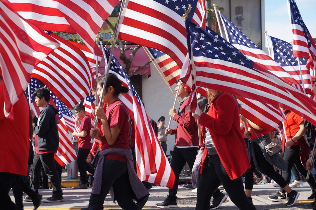 July 4th parade with crowd and American flags