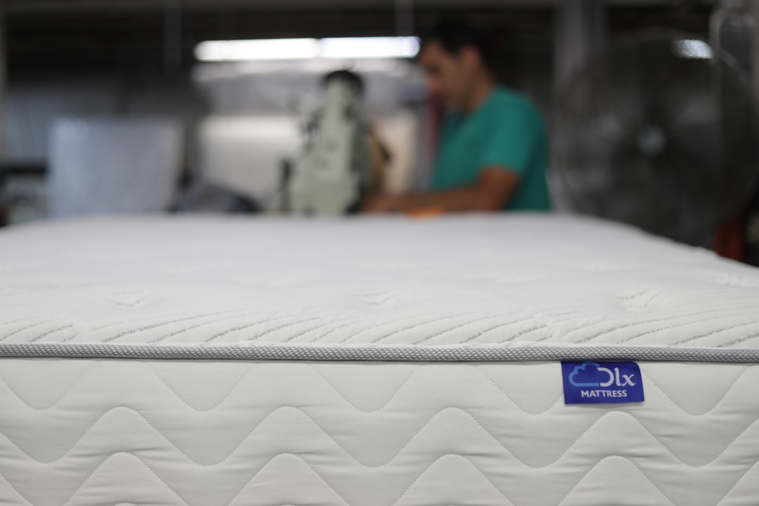 Foam mattress topper on campervan bed platform