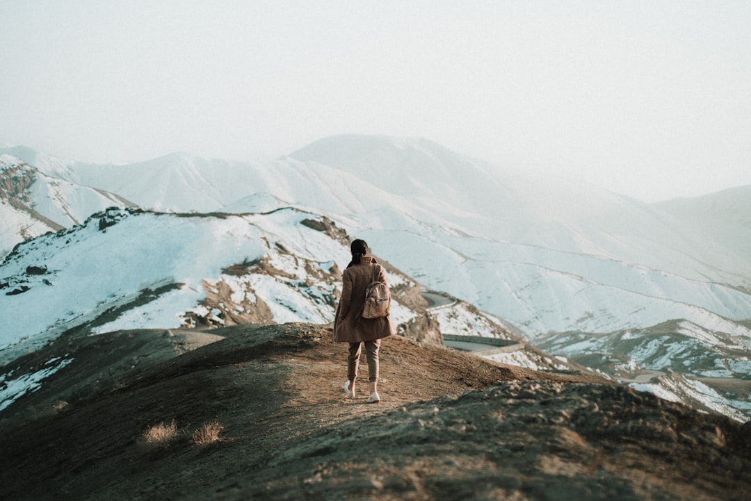 Woman hiking mountains alone