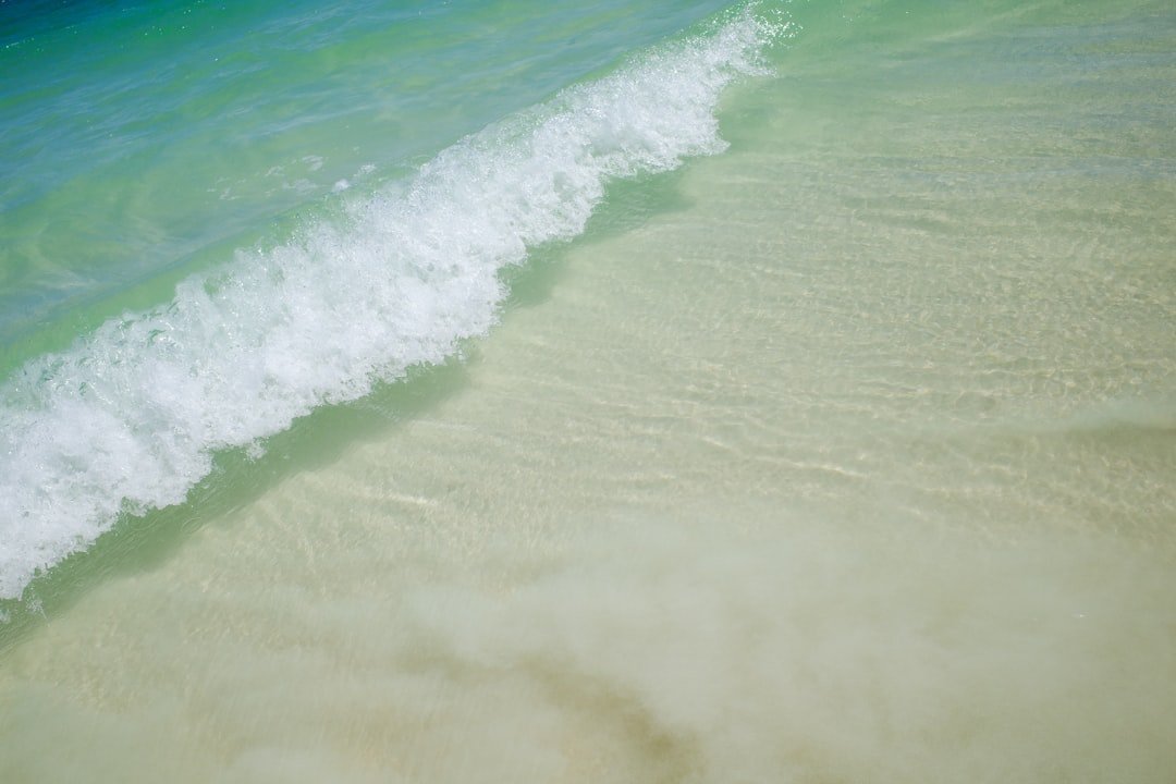 Coastal beach destination with clear turquoise water and white sand