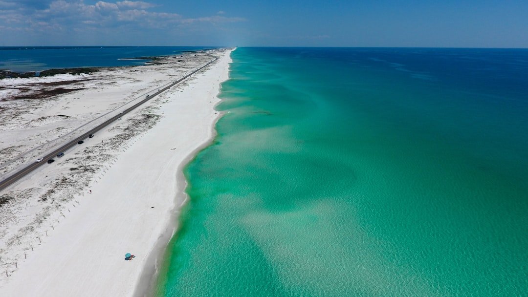 Gulf Coast beach with white sand and turquoise water
