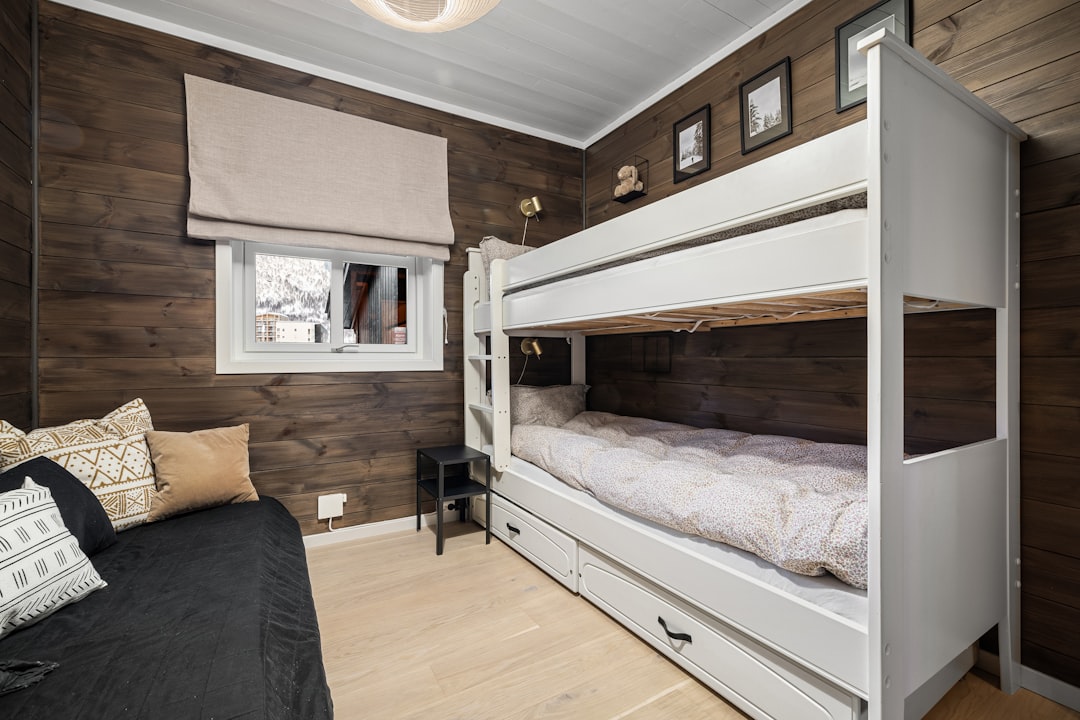 Campervan bedroom with storage drawers under bed platform