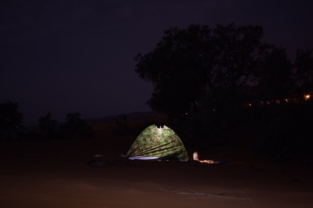 Memorial Day camping at night with tents illuminated