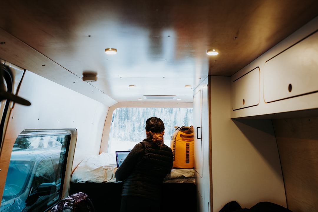 Campervan insulation materials installation process showing tools and materials