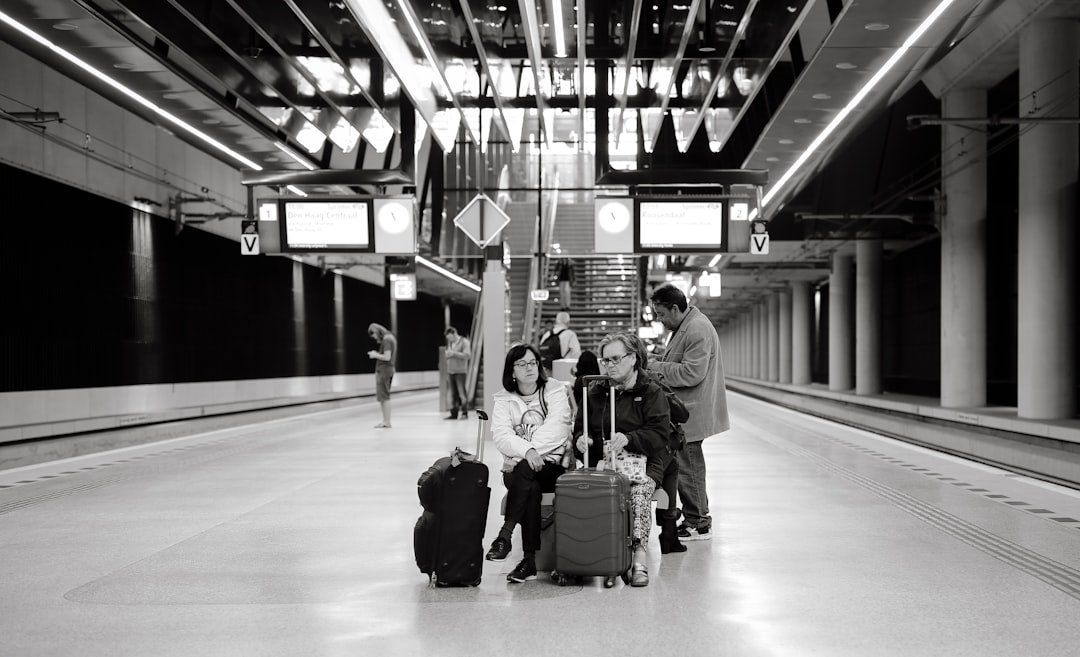 Happy family travelers at airport with children