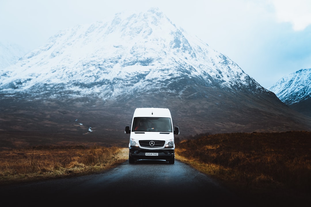 Campervan all seasons travel showing van in winter snowy landscape