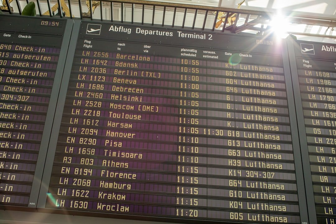 Airport terminal departure board with flight information
