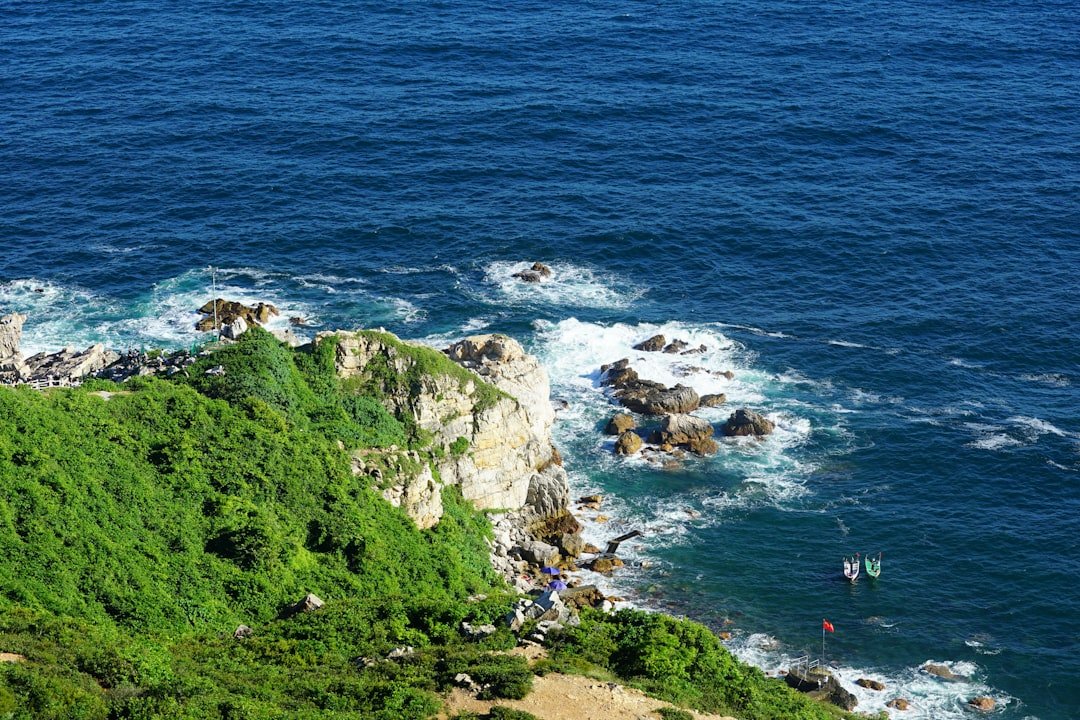 Kayaking along a rocky ocean coastline