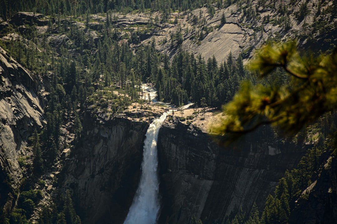 Yosemite waterfall cascading down granite cliffs in late spring