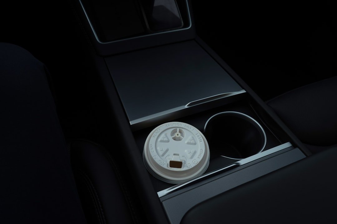Coffee cup on road trip dashboard
