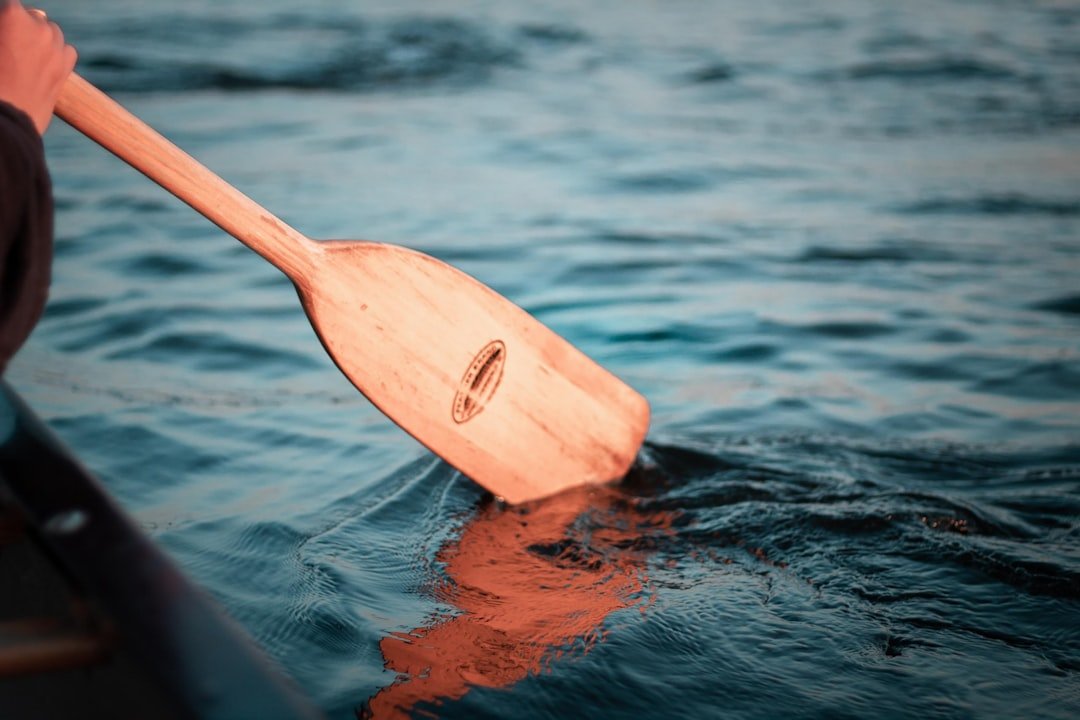 Kayaking on crystal clear water along a scenic shoreline