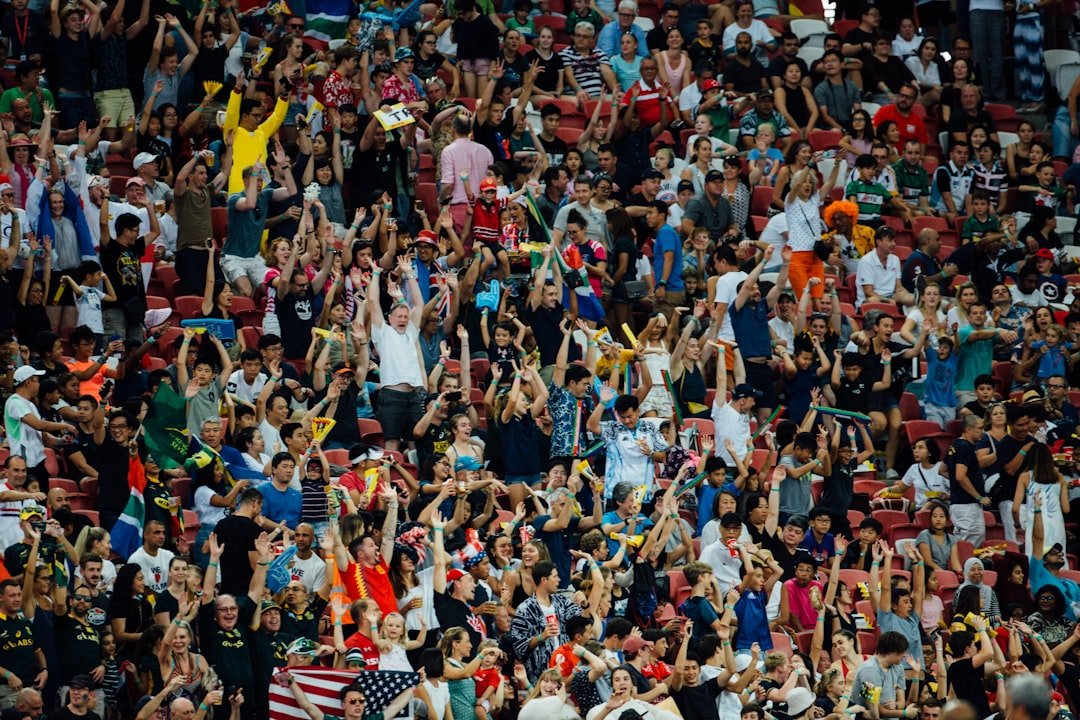 Soccer fans celebrating at a match