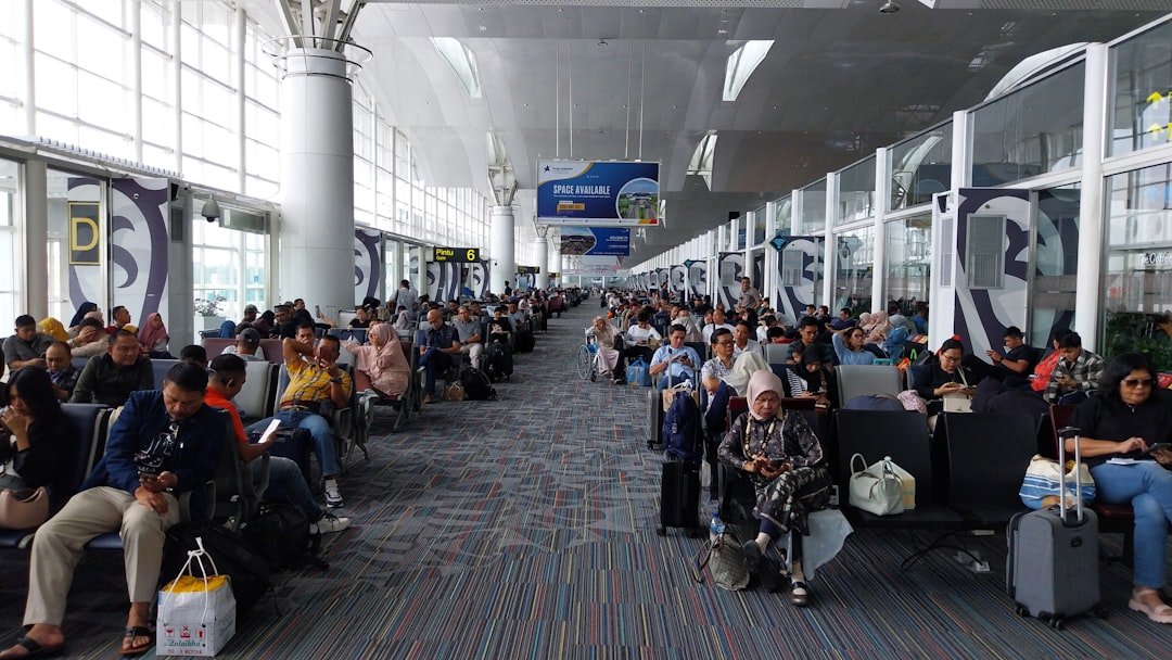 Airport departure area with travelers preparing for journey