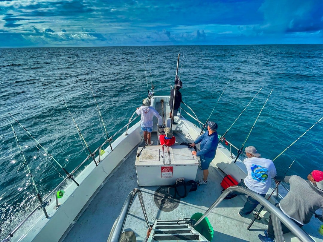 Deep sea fishing boat heading out on open ocean water
