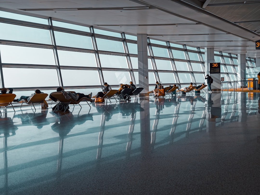 Traveler resting in airport lounge during layover