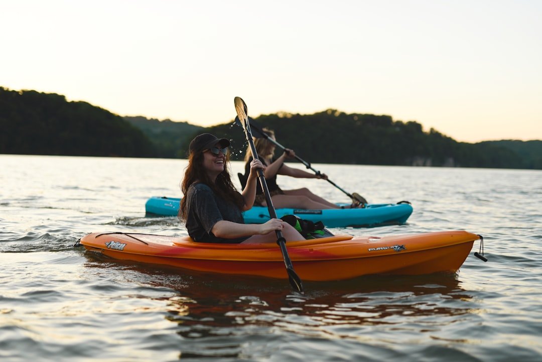 Kayaking on a mountain lake in summer