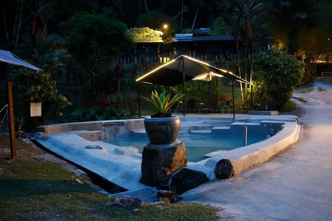 Natural hot springs pool surrounded by rock