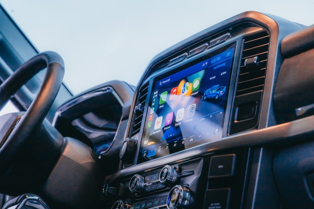 Digital display screen showing vehicle data in a car interior