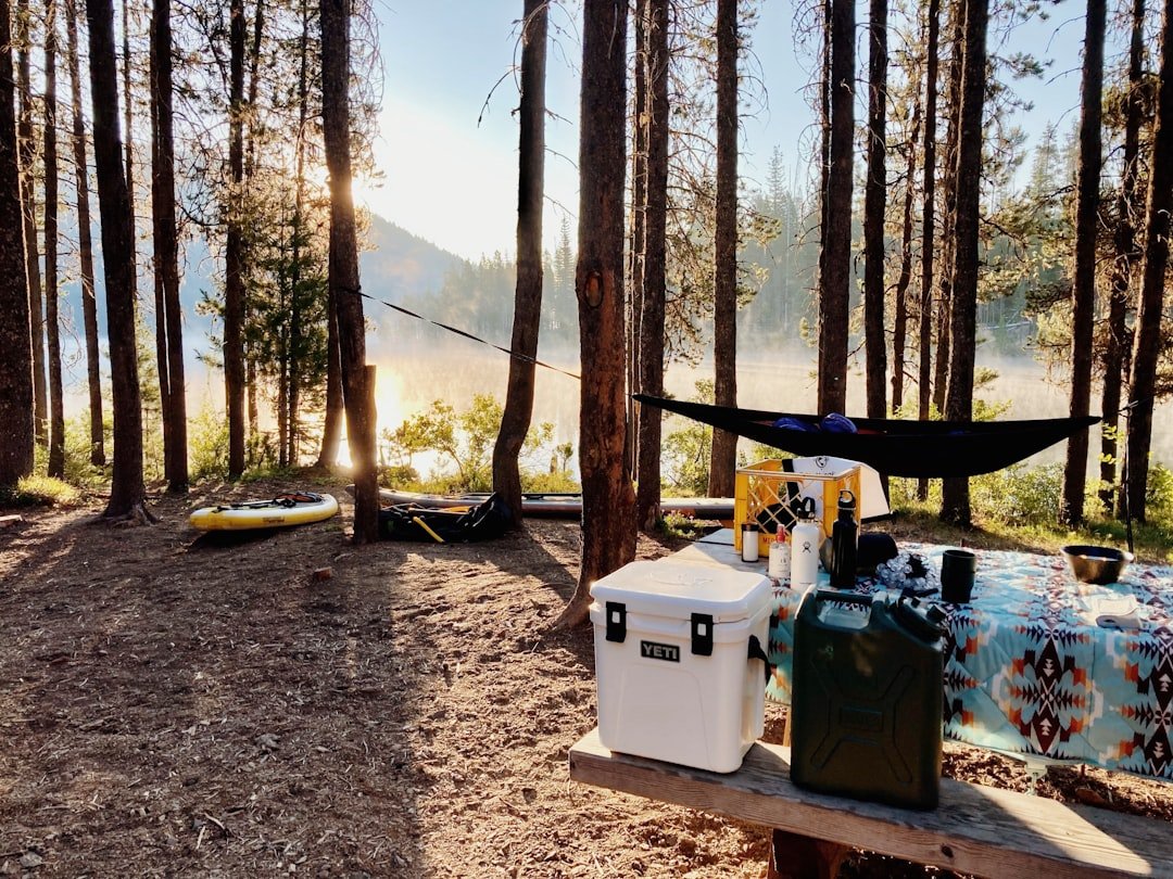 Portable cooler at a camping site outdoors