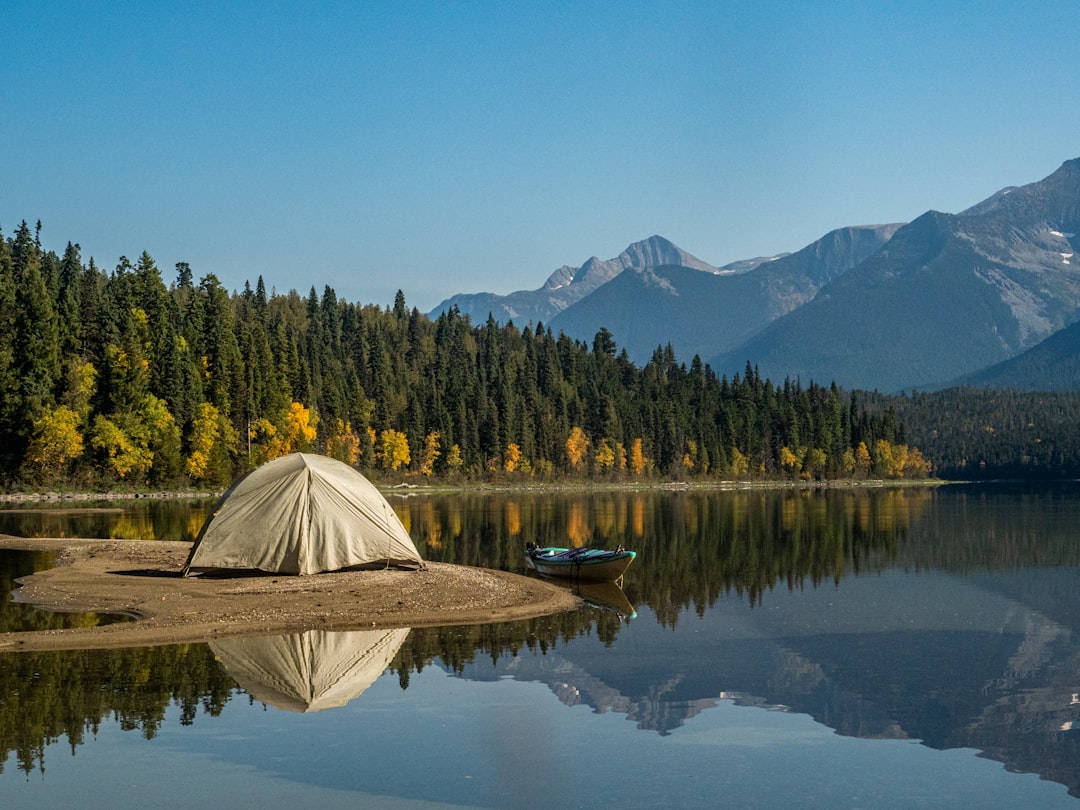 Tent camping on a remote island in a northern lake at sunset