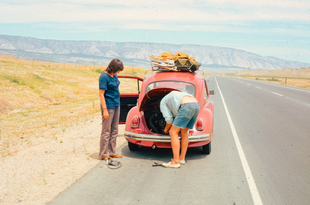 Car trunk packed with road trip gear and backpacks