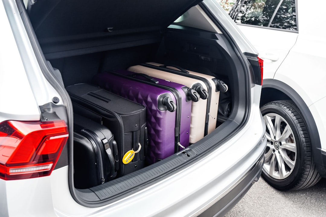 Road trip car trunk loaded with travel gear