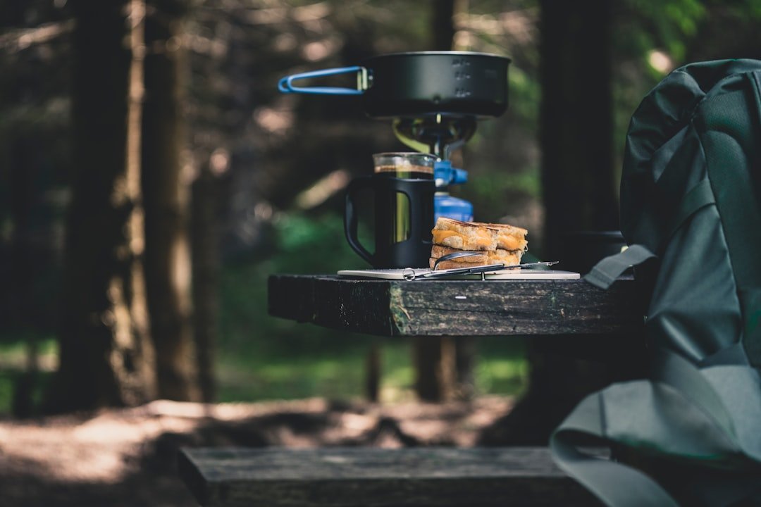 Portable cooler at a camp food setup