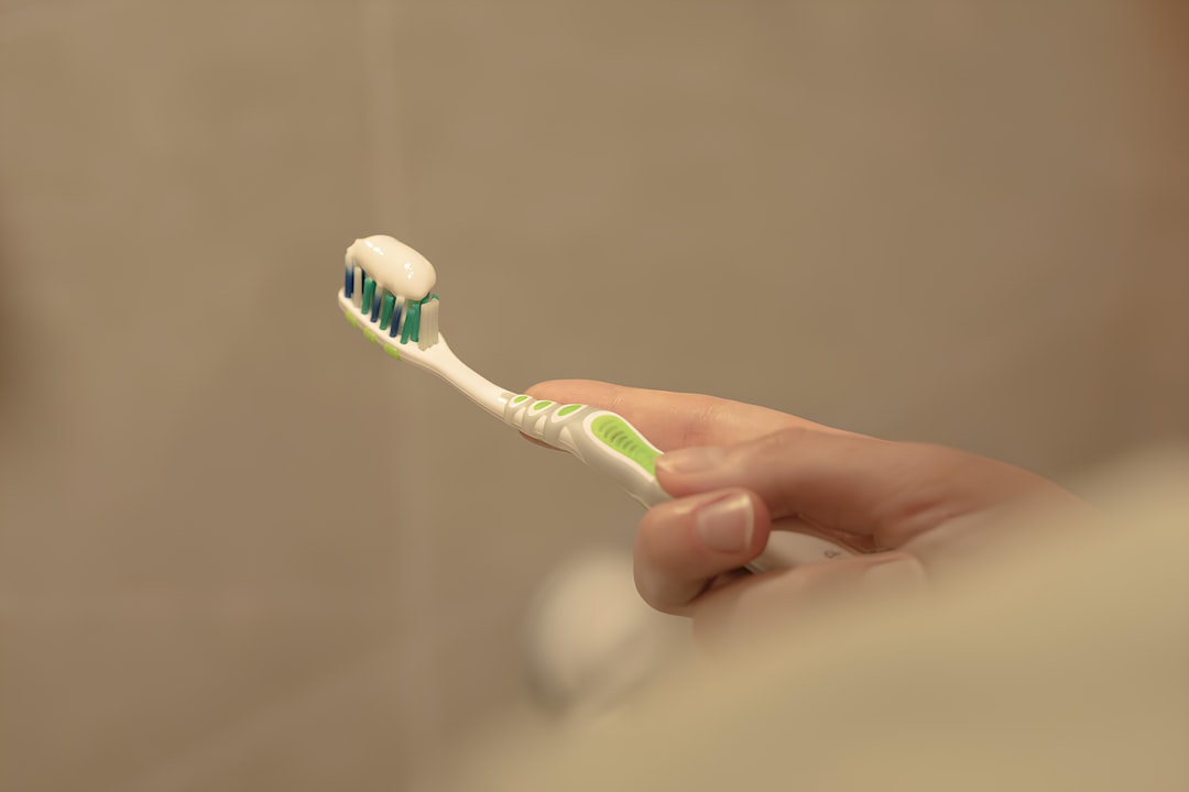 Modern electric toothbrush with travel case in bathroom setting