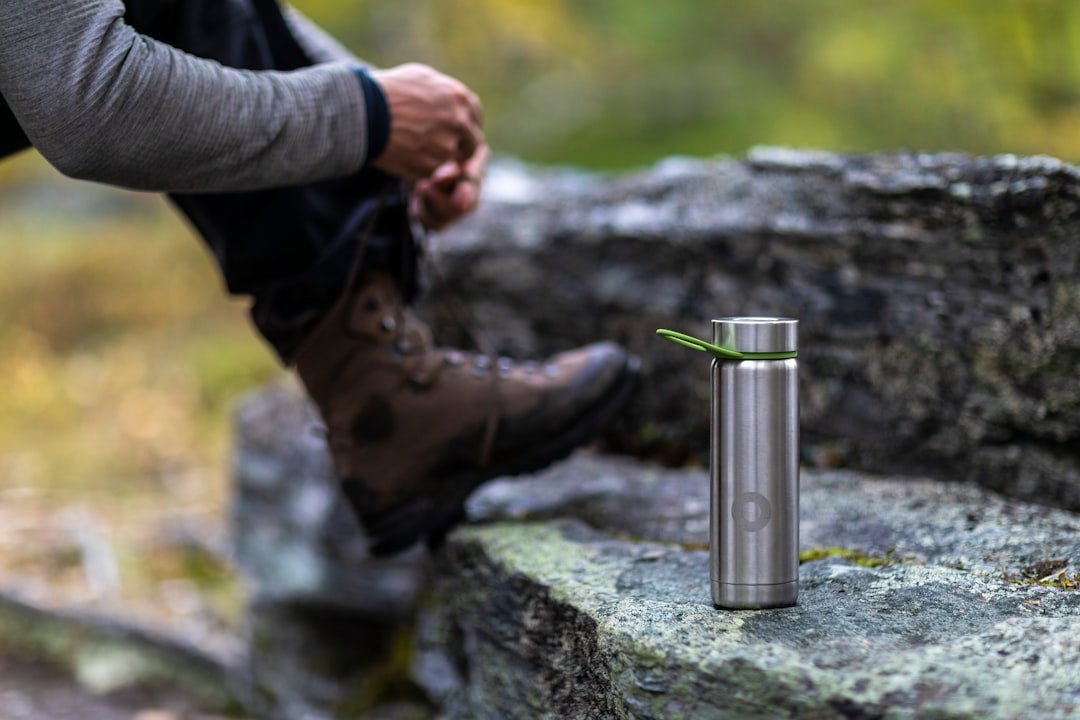 Water filter bottle being used on a hiking trail