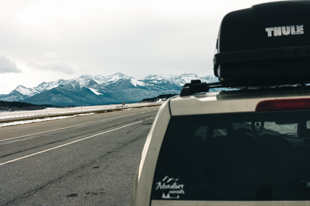 Rooftop cargo carrier on car during scenic road trip