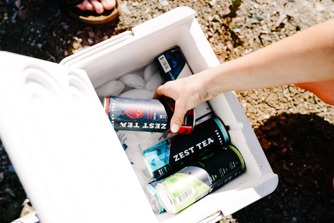 Open cooler filled with ice and cold drinks at a road trip stop