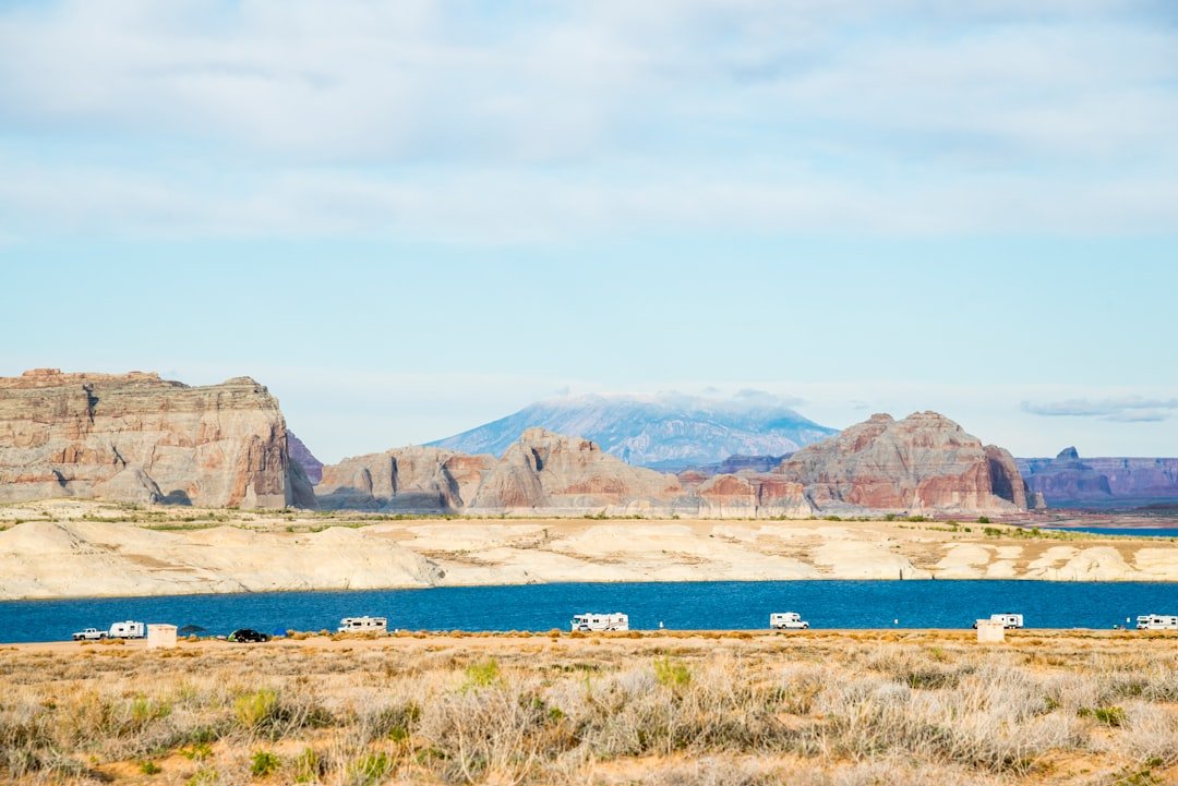 RV trailer camping off-grid in desert landscape at golden hour