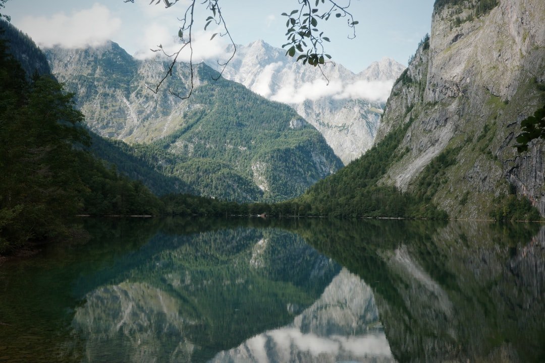 Alpine lake reflecting mountain scenery