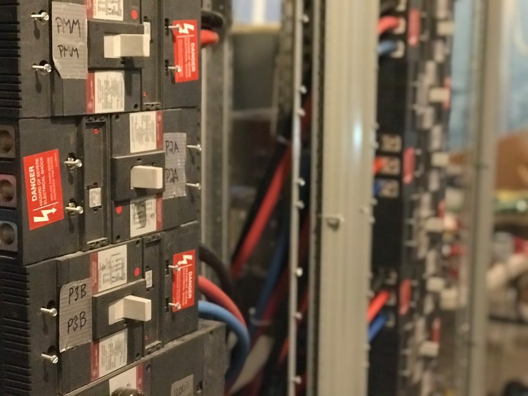 Electrical panel with inverter, shunt, and distribution fuses mounted in a campervan