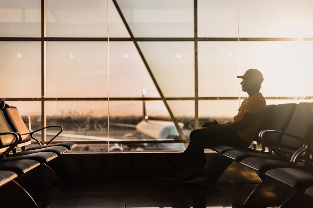 Traveler stretching legs at airport gate