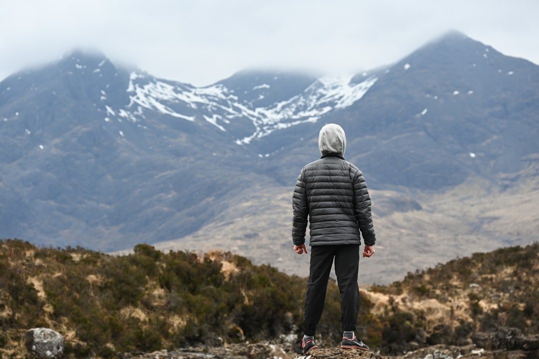 Packable puffer jacket on mountain trail