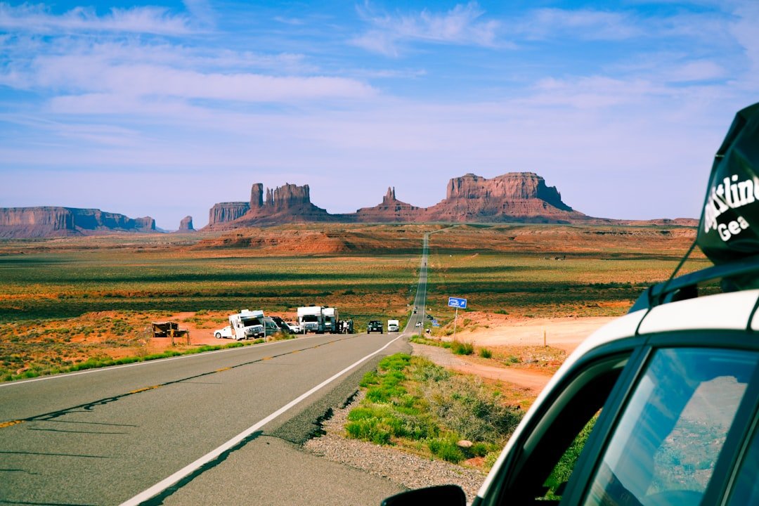 Campervan parked at scenic desert campsite with clear sky