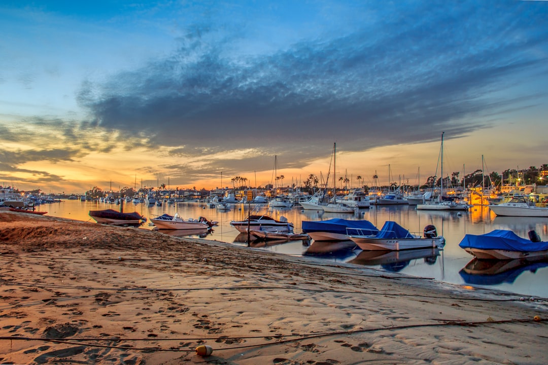Island harbor at sunset with moored boats