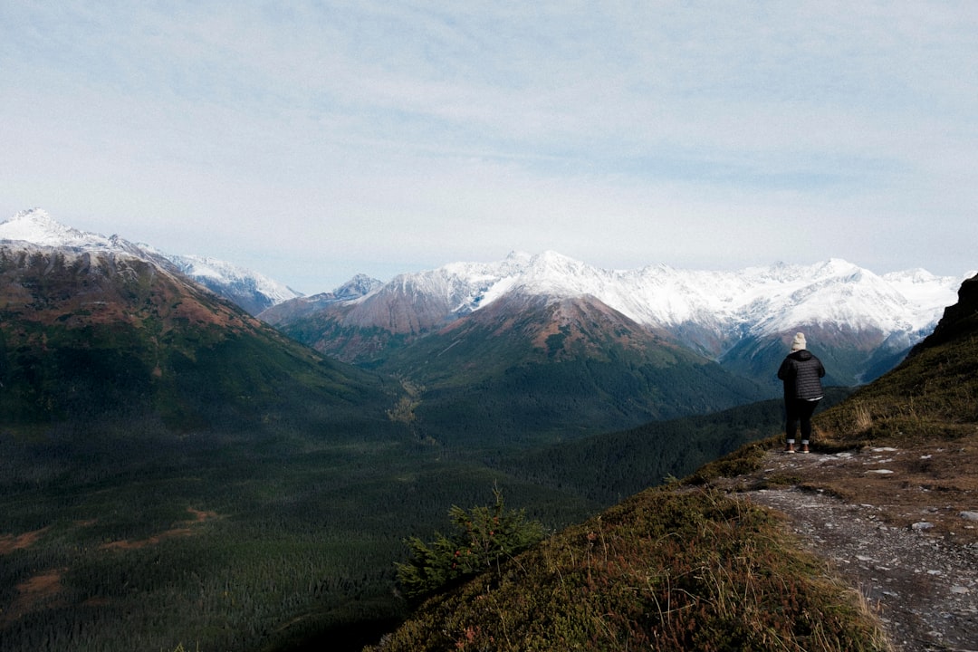 Hiker on mountain trail in Alaska