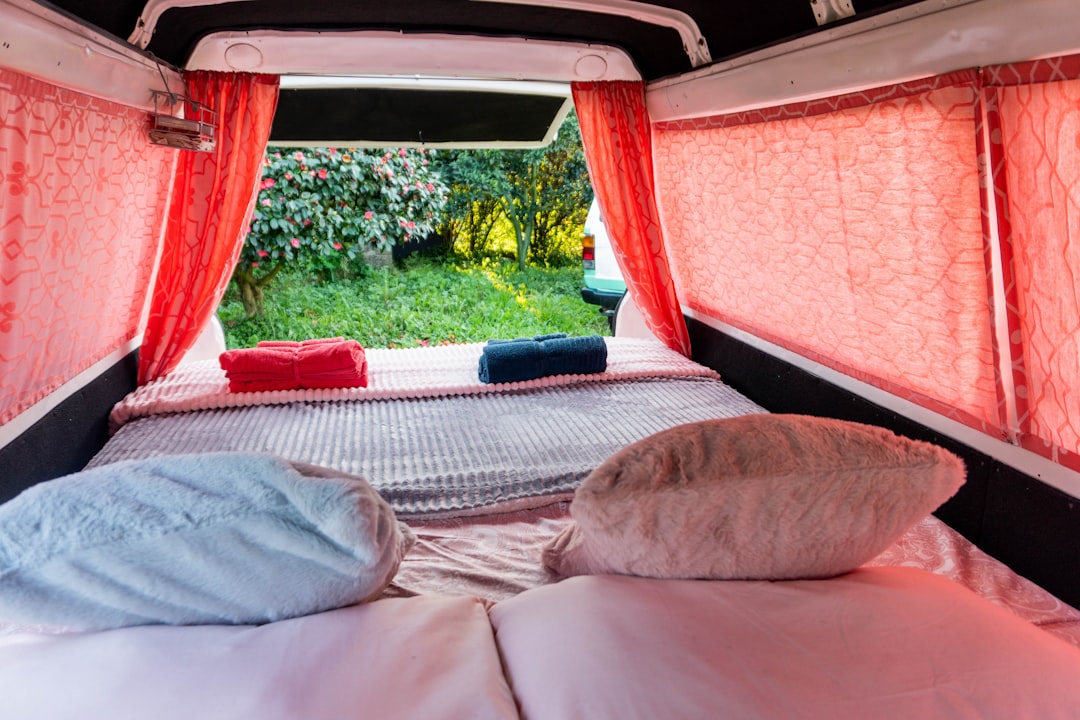Campervan sleeping area with comfortable bedding