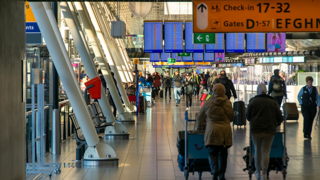 Passenger waiting in a bright airport departure hall
