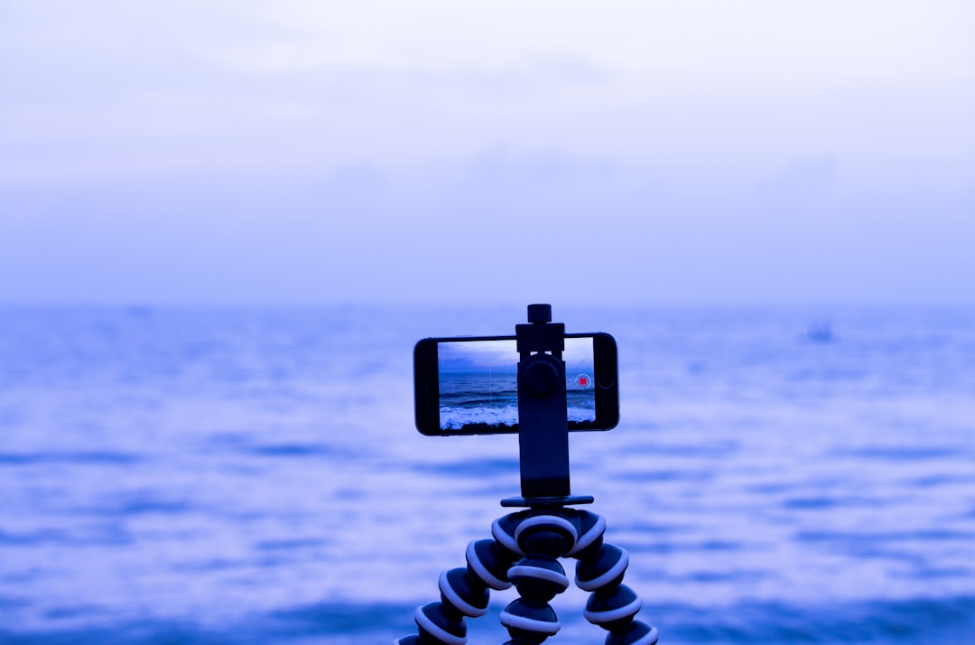 Camera tripod on a beach at sunset