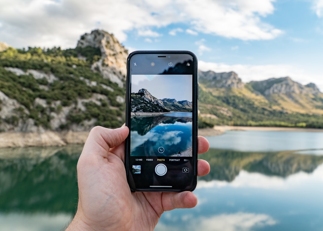 Smartphone mounted on a small travel tripod for a scenic shot