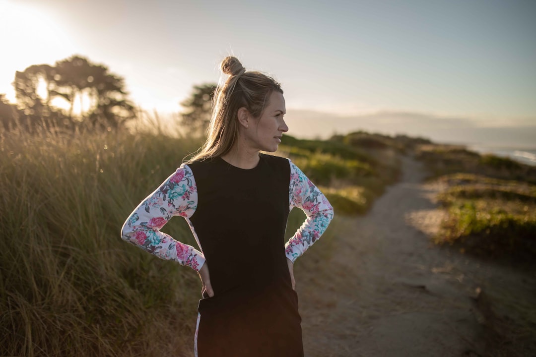 Hiker's arms protected with UV cooling sleeves on a sunny trail