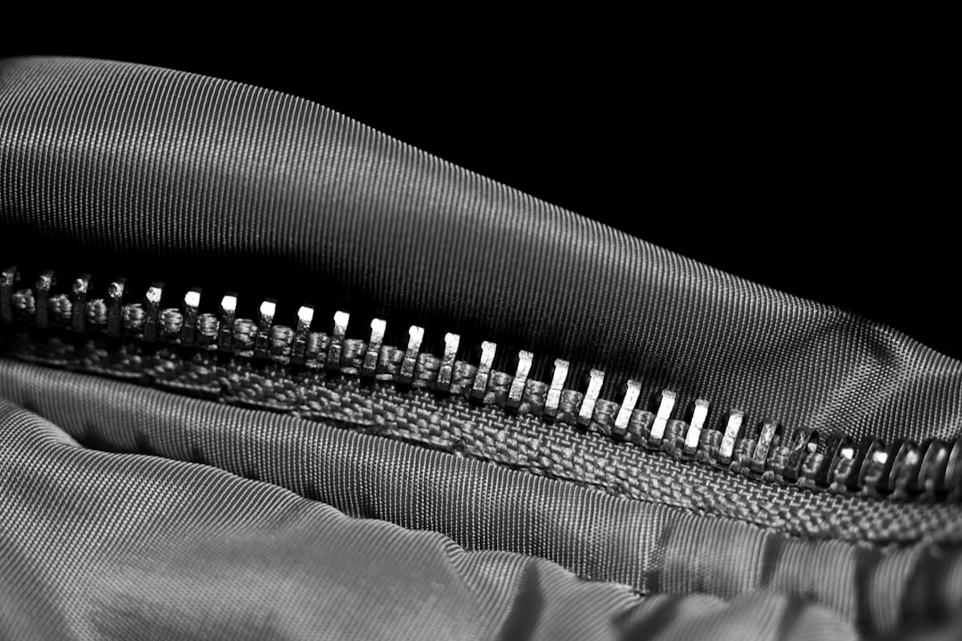 Close-up detail of backpack zipper teeth and pull