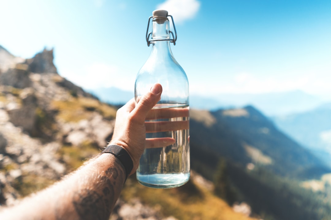 Water purification tablets and water bottle at campsite